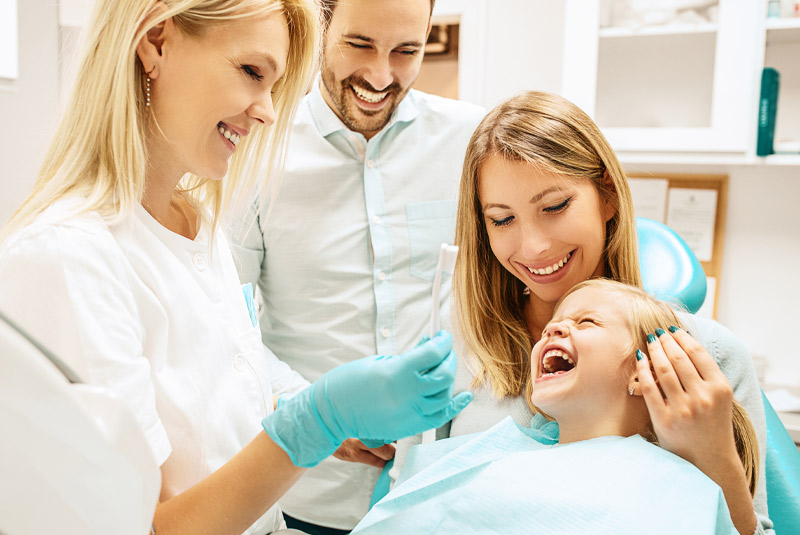 Nice family smiling because they took care of their dental needs