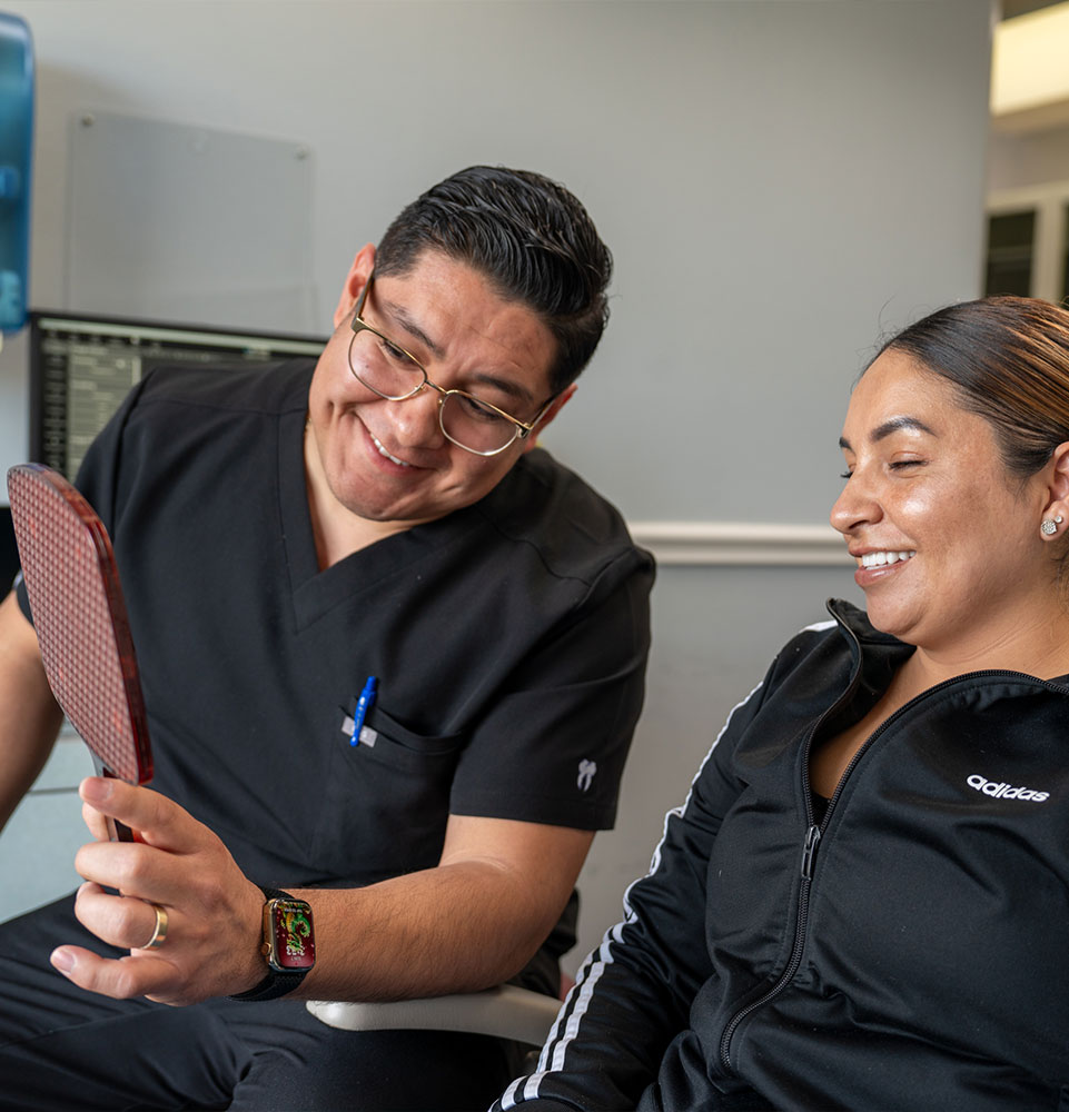 patient and doctor going over dental procedure information within the dental center