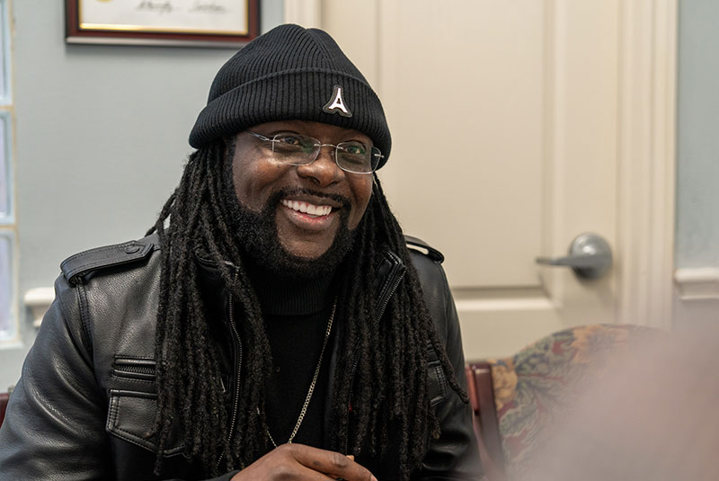 patient smiling while going over dental procedure information within the dental center